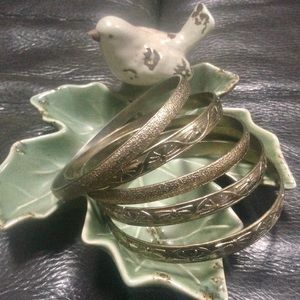 FIVE GOLD BANGLE BRACELETS